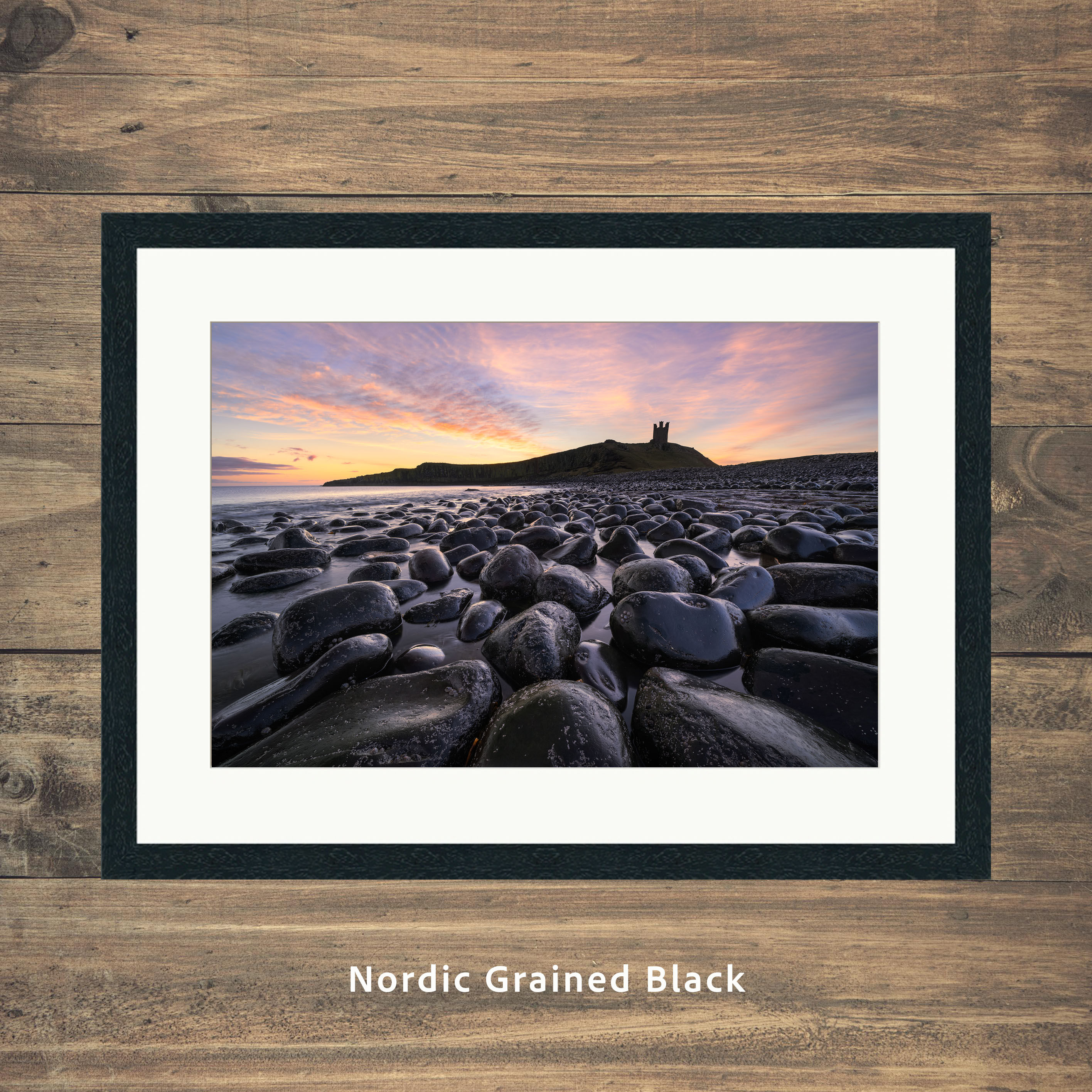 Framed photography picture prints of a beautiful sunrise at Dunstanburgh Castle on The Northumberland Coast, UK.