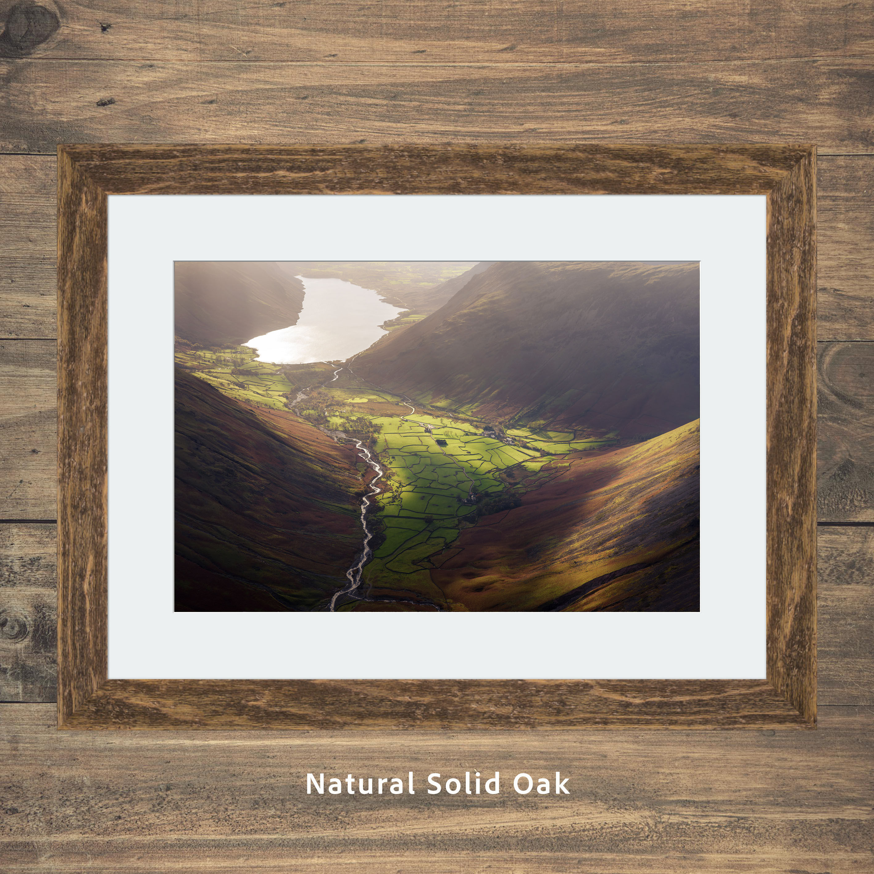 an aerial view of the green fields and dry stone walls down in the valley of Wasdale Head in The Lake District, UK.