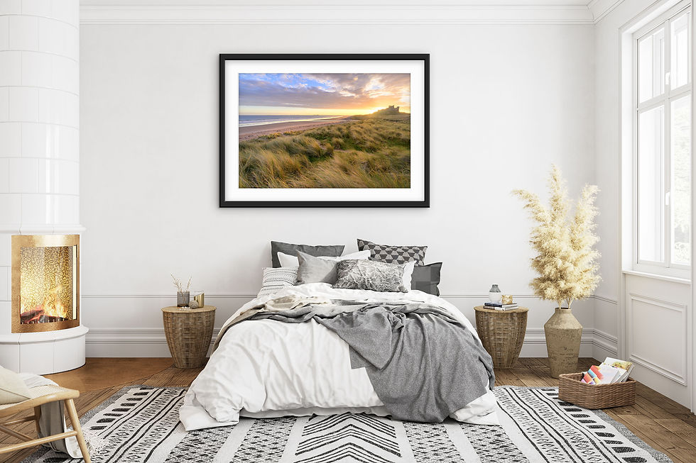 Thumbnail: Golden morning sunlight at Bamburgh Castle with sand dunes and view of Northumberland coast.