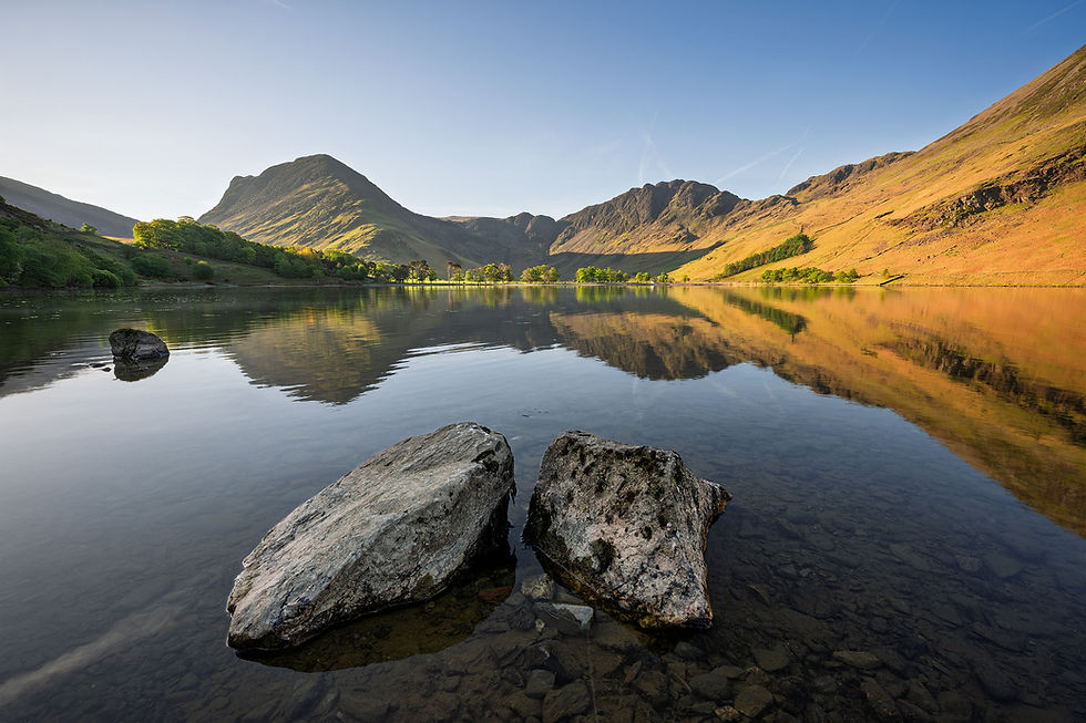 calm spring morning with clear reflections at Buttermere, with views of Fleetwith Pike & Haystacks in The Lake District.