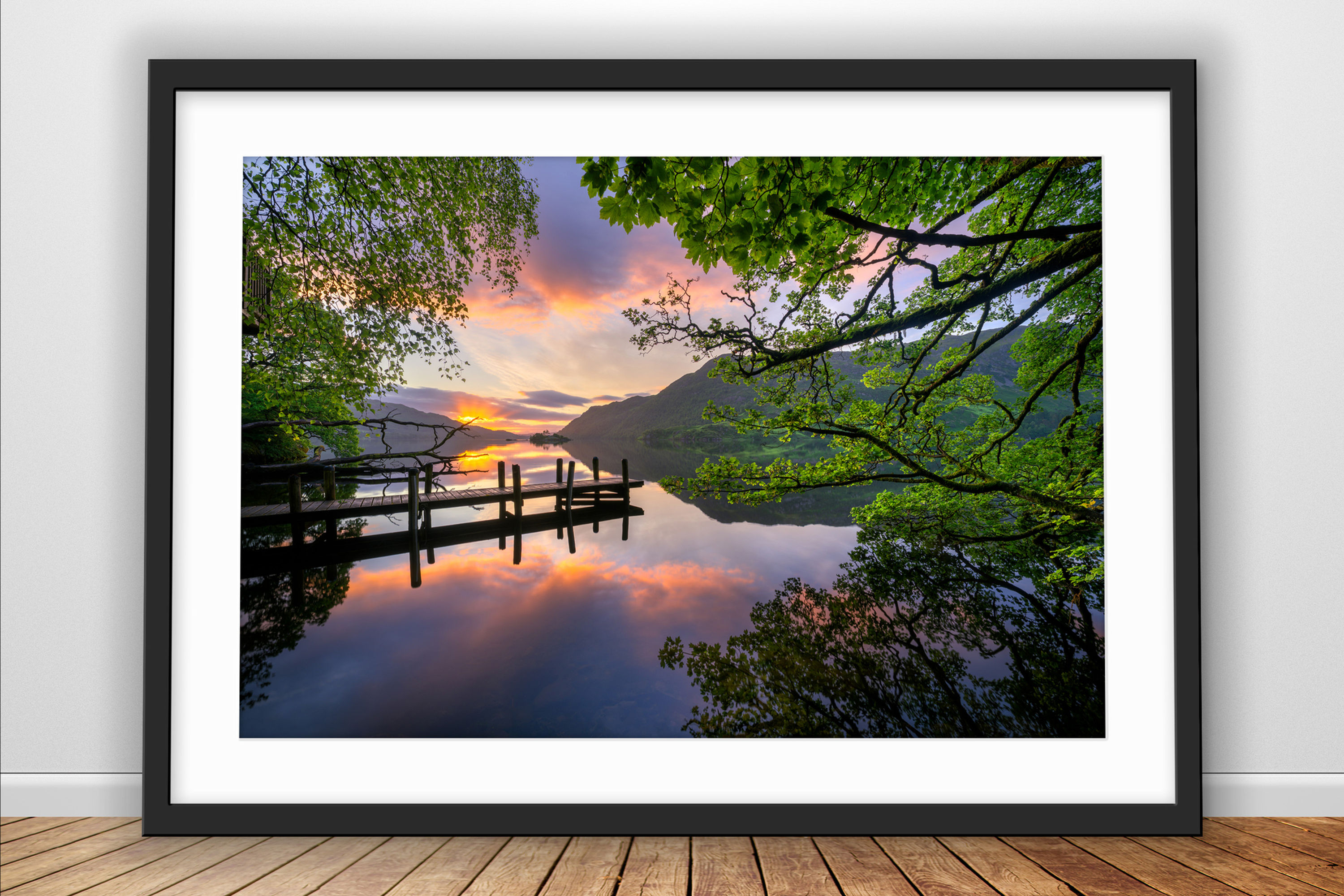 Beautiful photography prints of a summer sunrise overlooking a wooden jetty at Ullswater in The Lake District, UK.