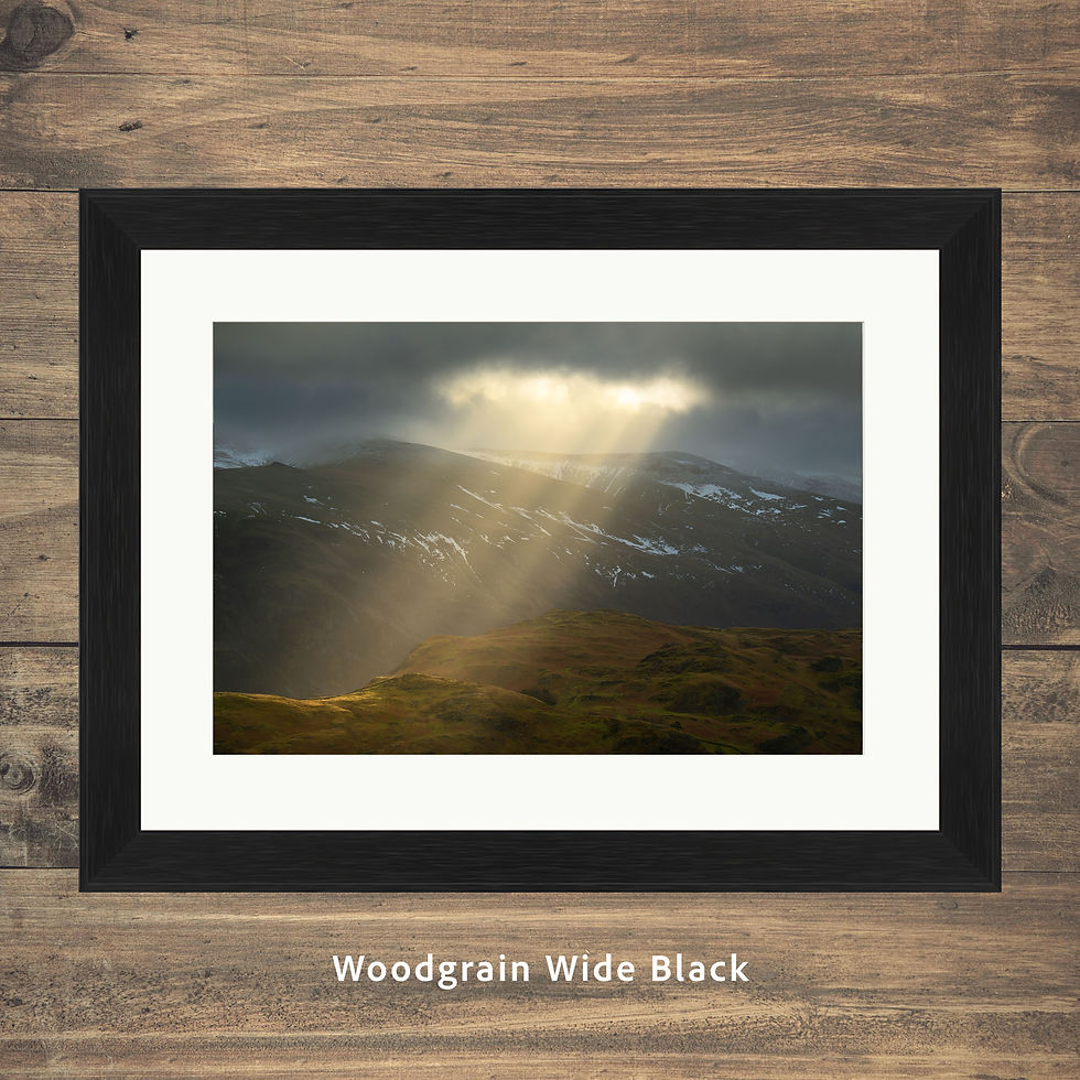 Thumbnail: Framed prints of a dramatic view looking over to The Helvellyn Range as rays of light break from the clouds. Lake District.
