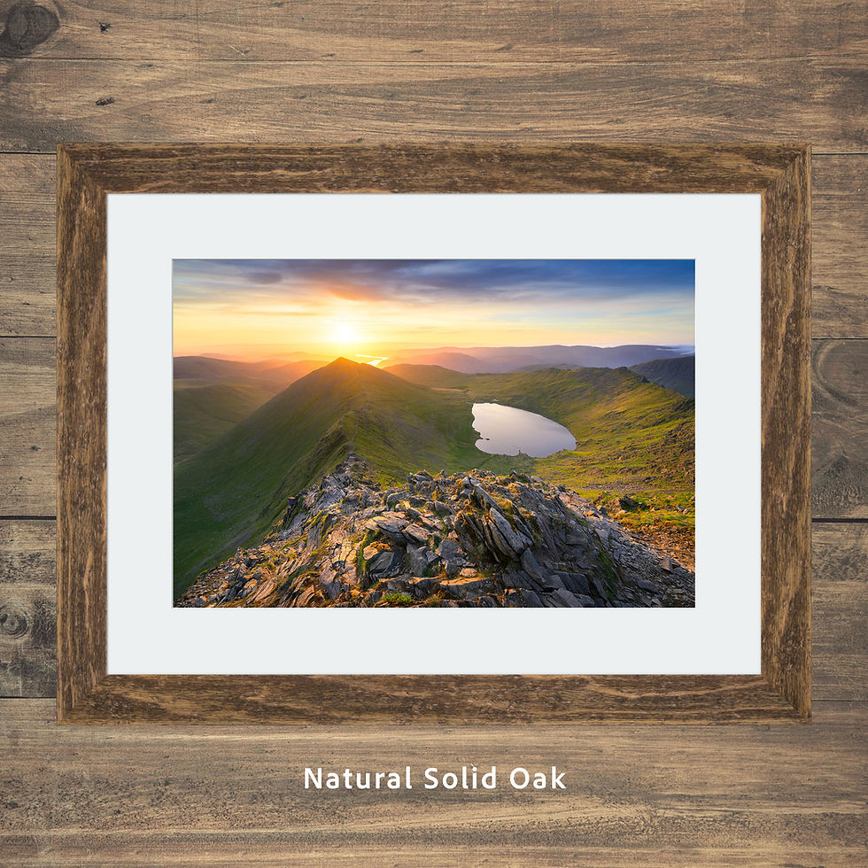 Thumbnail: Golden morning sunlight moments after sunrise overlooking Swirral Edge and Red Tarn, Helvellyn, Lake District mountains.