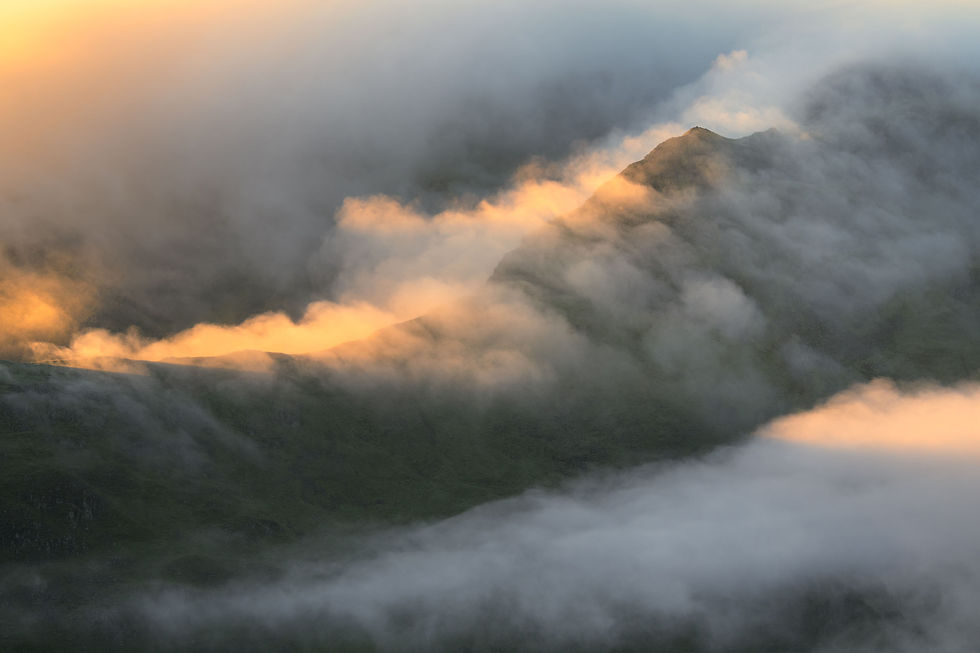 misty view looking down to the iconic mountain ridges of The Fairfield Horseshoe, seen from Helvellyn in The Lake District