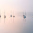 Thumbnail: Photography prints of a row of yachts on a misty Windermere in The Lake District, UK.