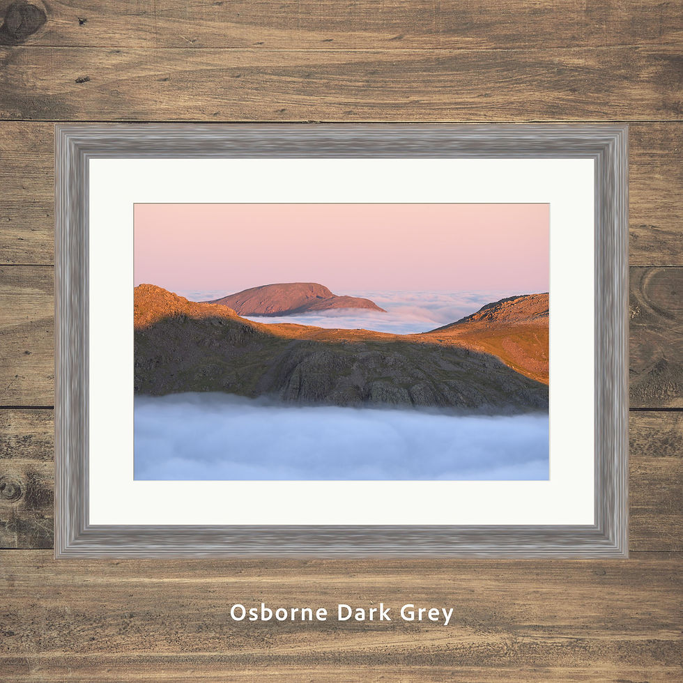 Thumbnail: Framed photography prints of beautiful sunrise light up in the mountains of the Lake District with Pillar poking out of cloud