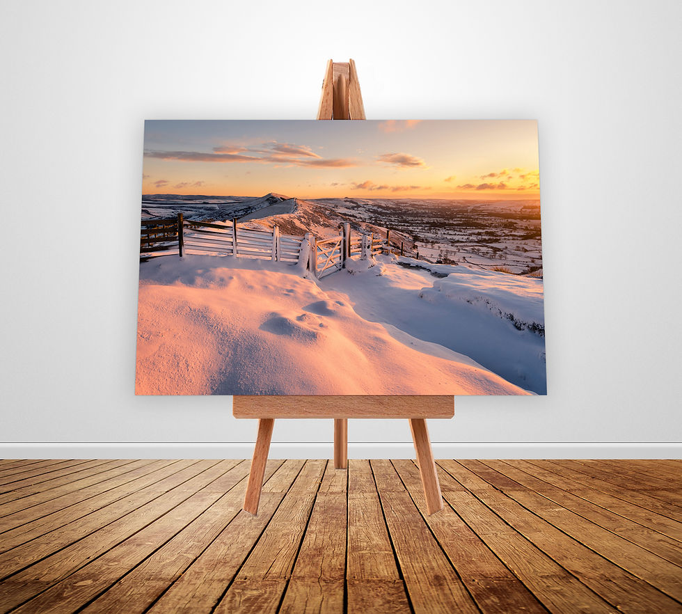 A beautiful winter sunrise on a snow covered Mam Tor in The Peak District National Park.