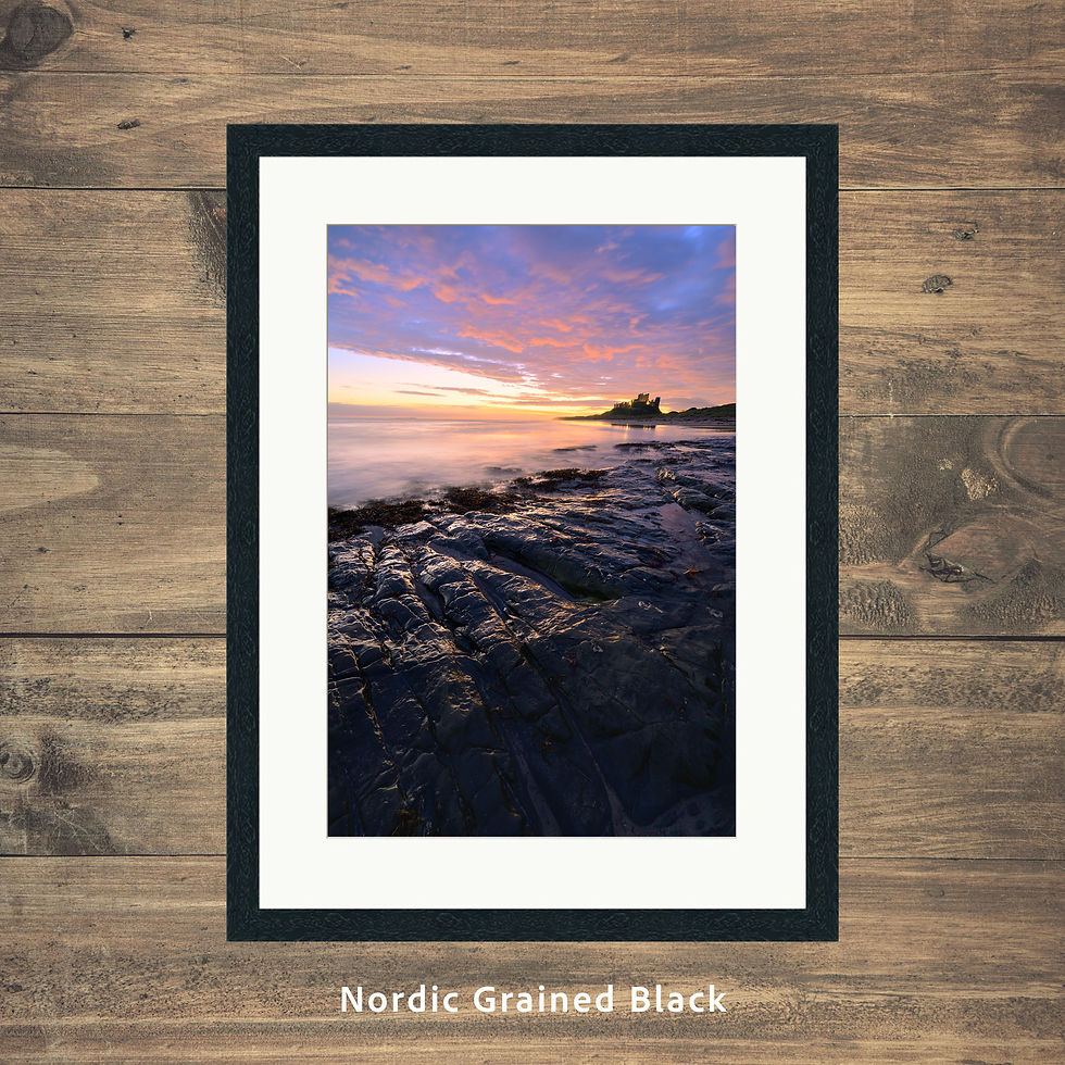 Thumbnail: Framed photography prints of a blue hour sunrise at Bamburgh Castle on the Northumberland Coast, UK.