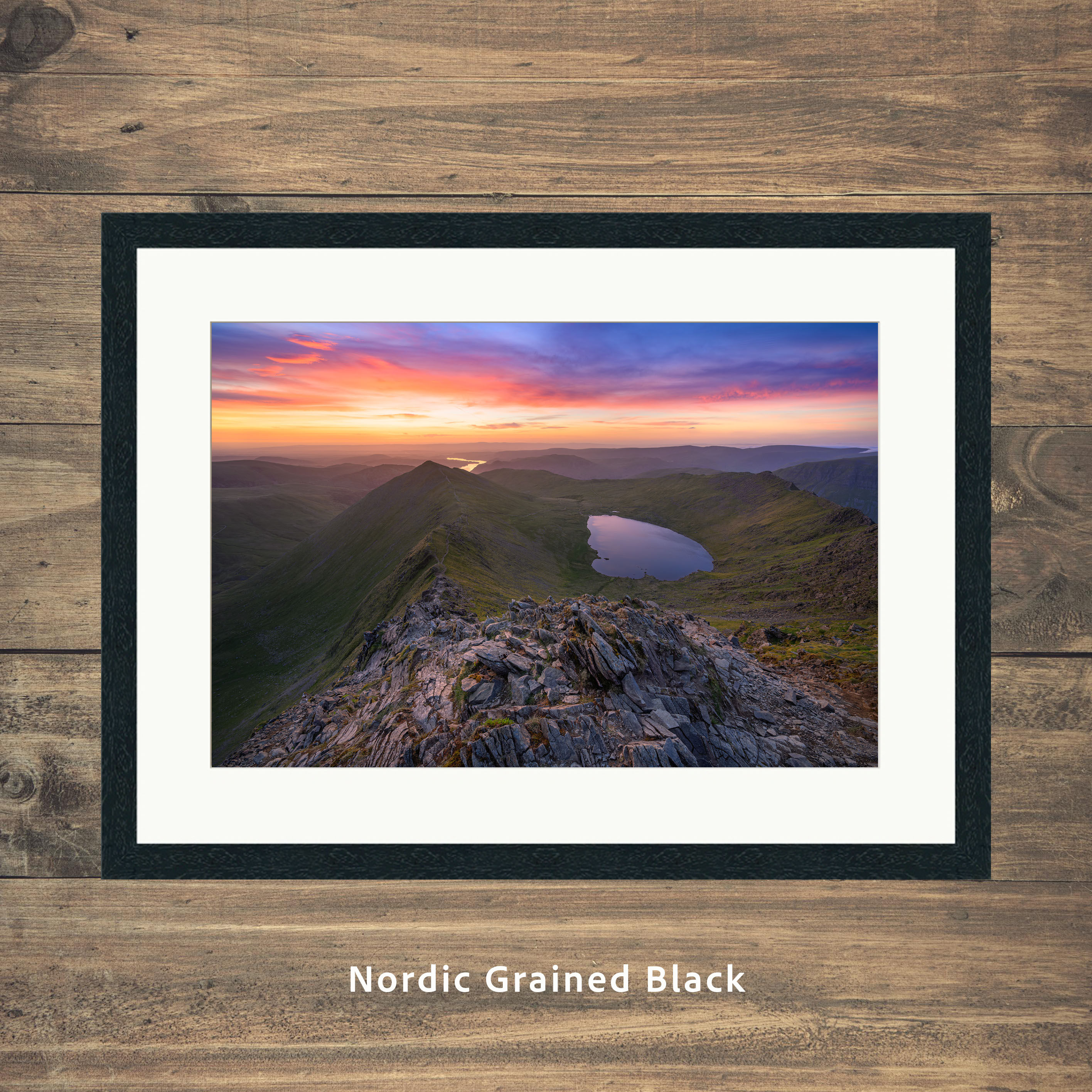 A breathtaking view overlooking Swirral Edge, Red Tarn & Ullswater, seen from Helvellyn at sunrise in The Lake District.