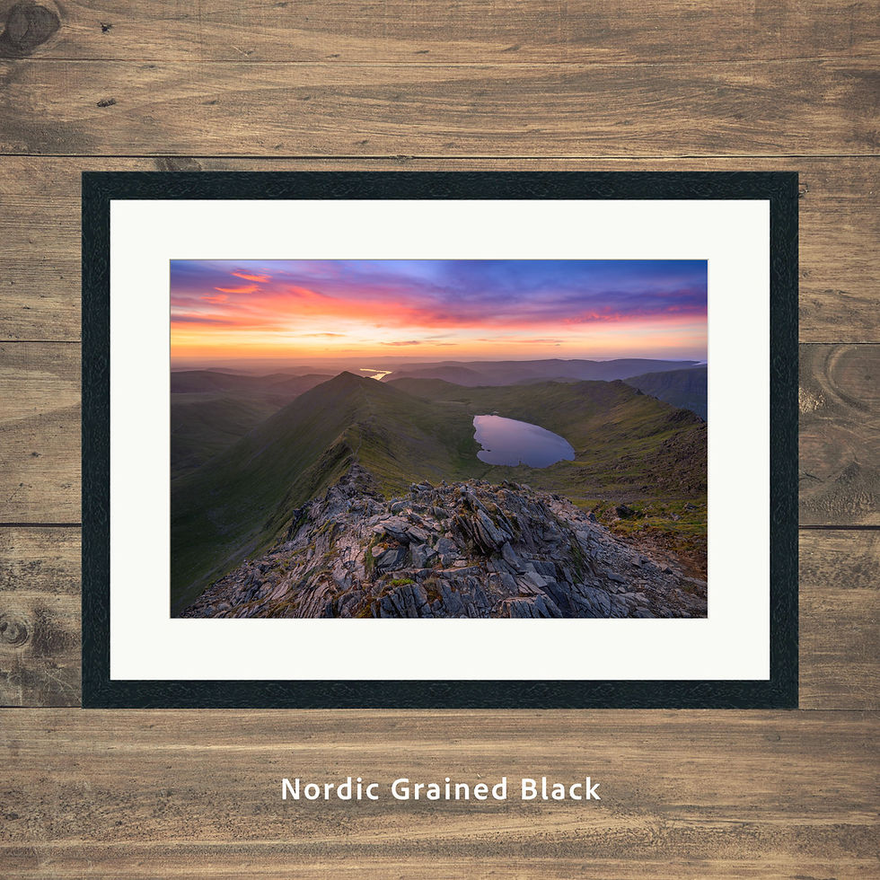 A breathtaking view overlooking Swirral Edge, Red Tarn & Ullswater, seen from Helvellyn at sunrise in The Lake District.