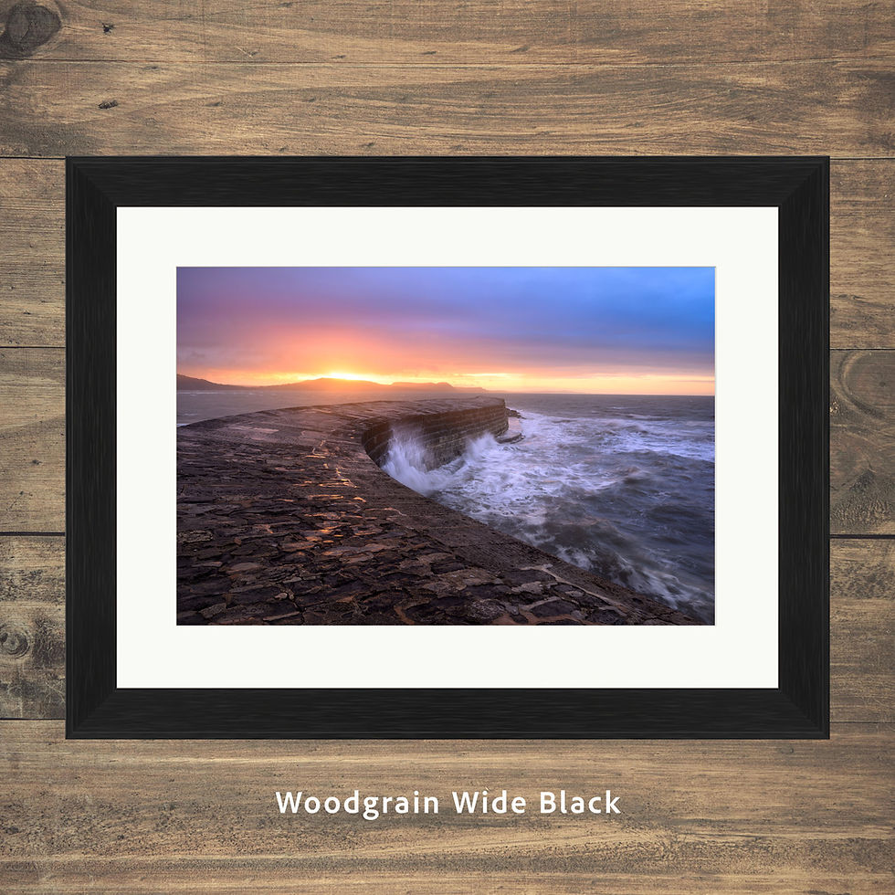 Thumbnail: Framed photography prints of a dramatic coastal view of the Cobb at Lyme Regis in Dorset, UK. Taken at sunrise.