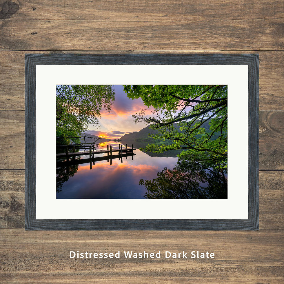 Thumbnail: A beautiful Lake District sunrise with a wooden jetty over a calm peaceful view of Ullswater.