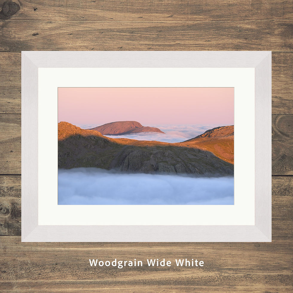 Thumbnail: Framed photography prints of beautiful sunrise light up in the mountains of the Lake District with Pillar poking out of cloud