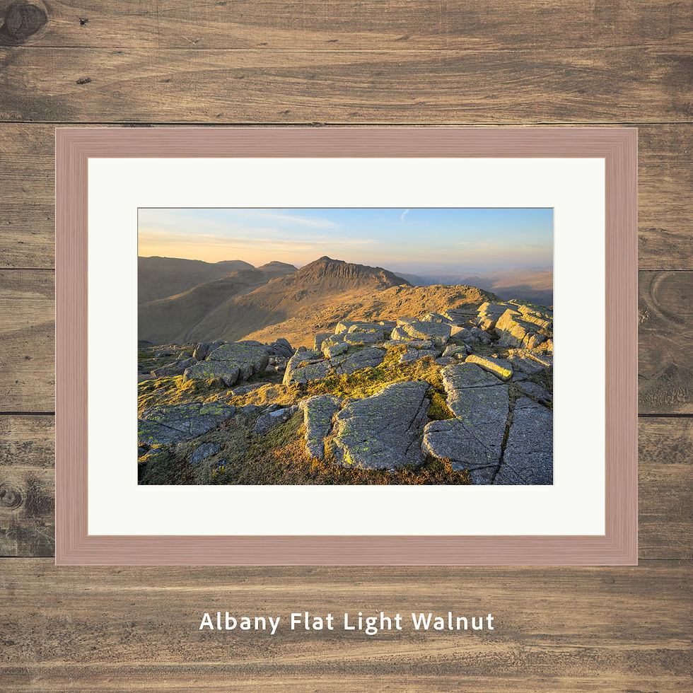 Thumbnail: Framed prints of a calm spring evening with golden light on rocks up Crinkle Crags in The Lake District mountains.