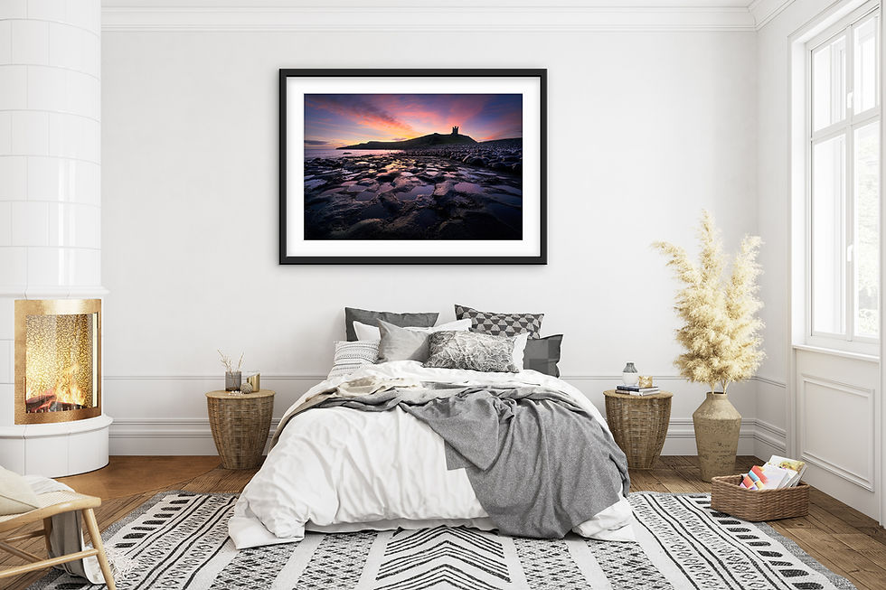 Thumbnail: Beautiful photography prints of a winter sunrise over Dunstanburgh Castle on the Northumberland coastline.