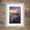 Thumbnail: Framed photography prints of a dramatic sunrise over the coast at Bamburgh Castle in Northumberland, UK.