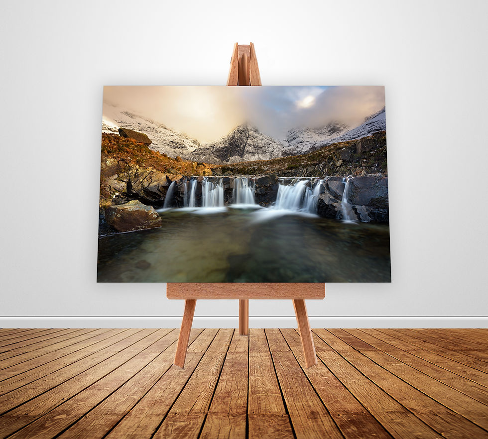 A flowing waterfall on a fresh winter afternoon with snowcapped views of Cuillins at The Fairy Pools on The Isle of Skye.