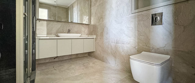 Bathroom with vanity, mirror and shower
