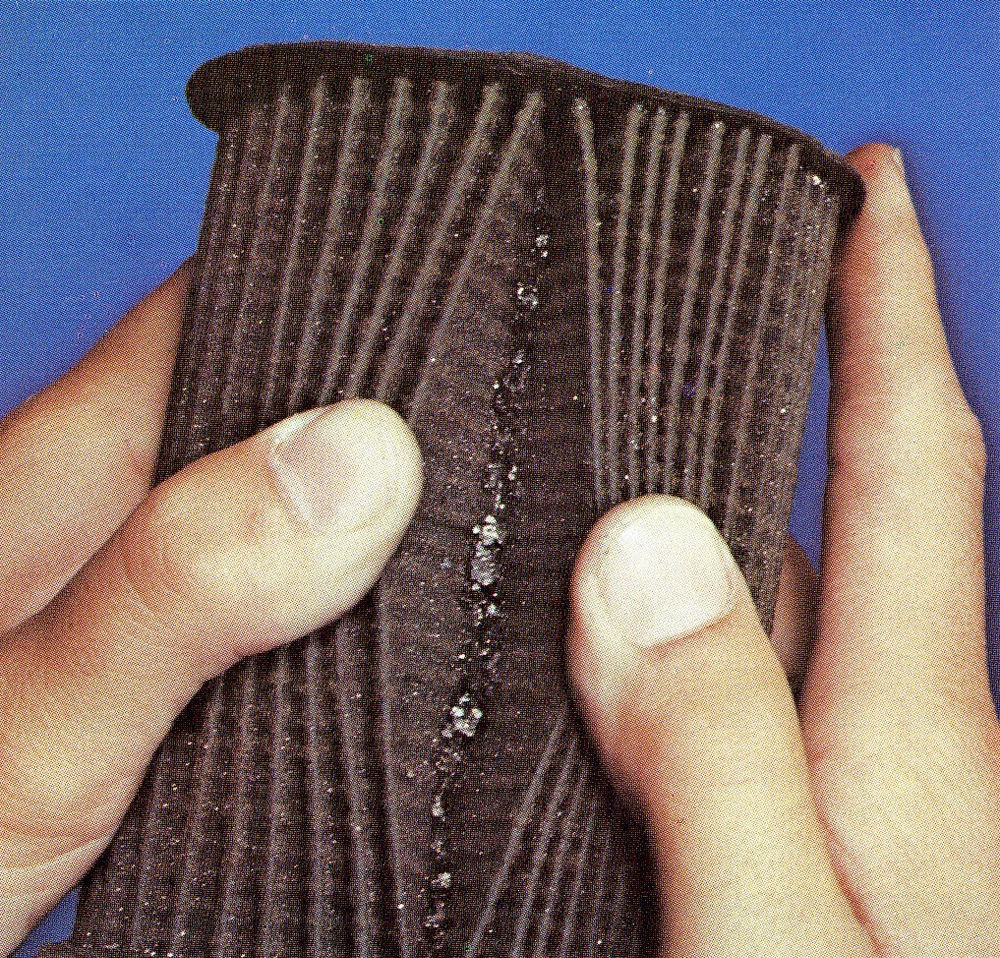 How to cut open an engine oil filter and what to look for.