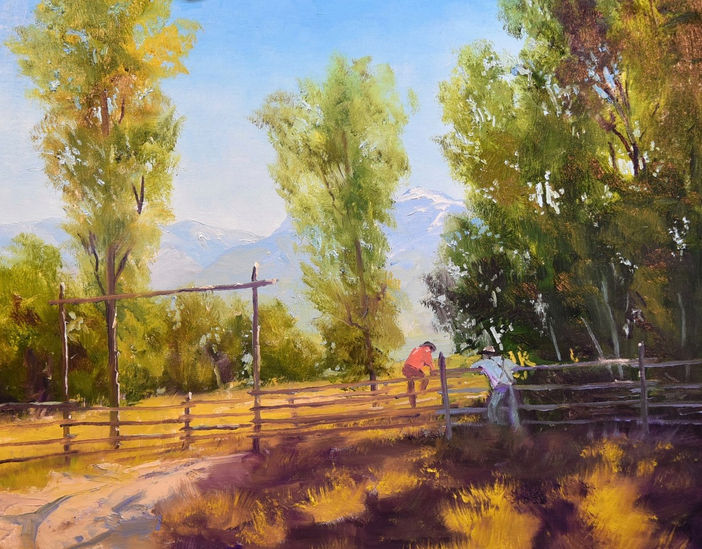 An oil painting of ranch-hands lingering on a fence with fall trees providing shade and distant mountains with snowcapped peaks by Master American painter Michael Ome Untiedt.