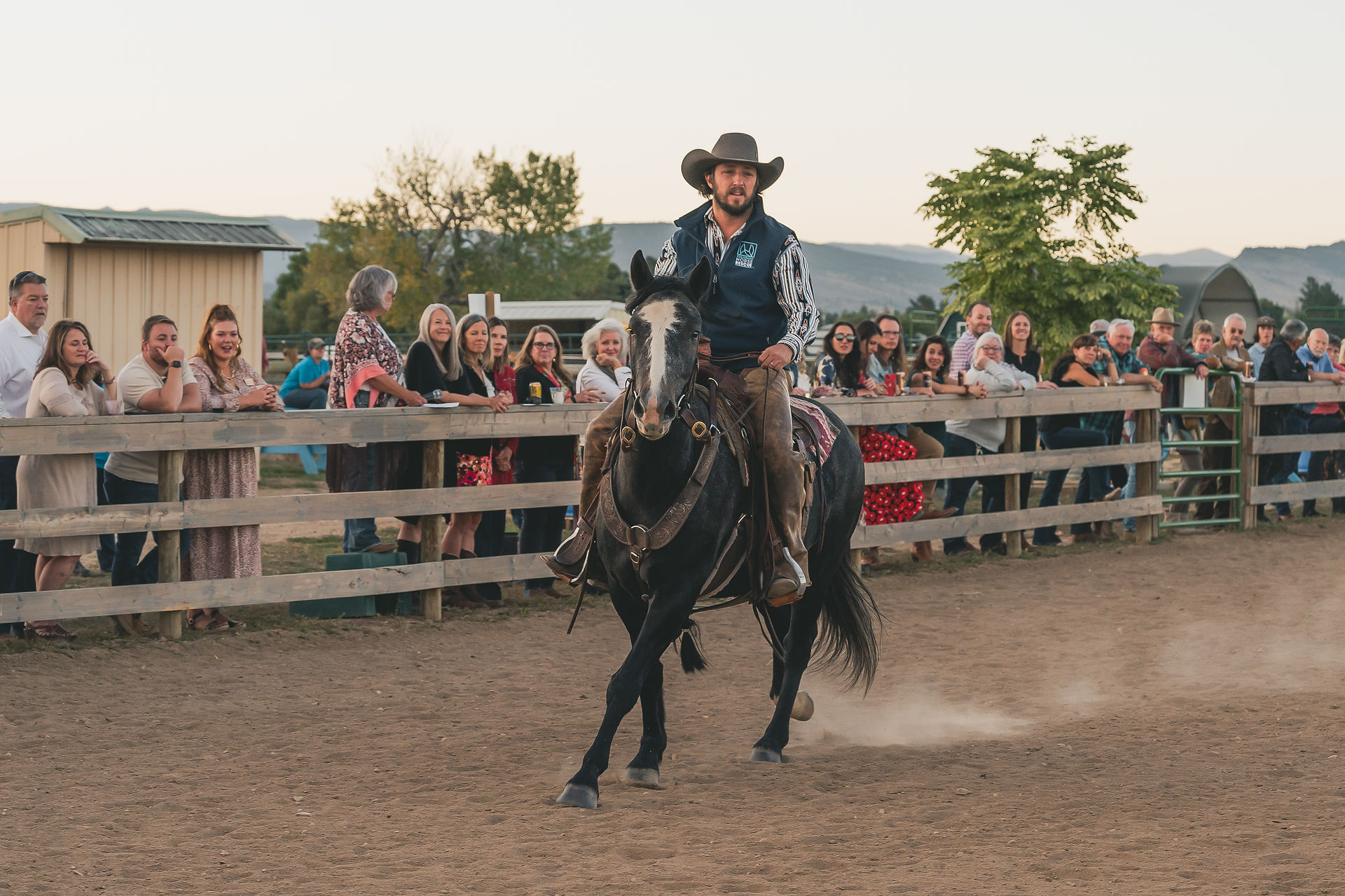 A photograph of a demonstration with a horse and rider during the PEAK Challenge at Colorado Horse Rescue in Longmont, Colorado