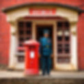 a postman near post box antique at shimla.jpg