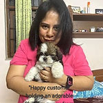 "Happy customer holding an adorable Shih Tzu puppy from Parth Kennel."