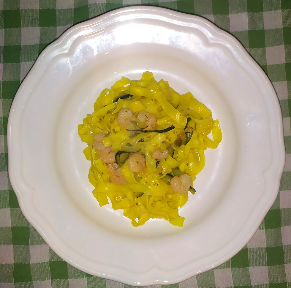 A wonderful tagliattele plate with a green cloth in the background