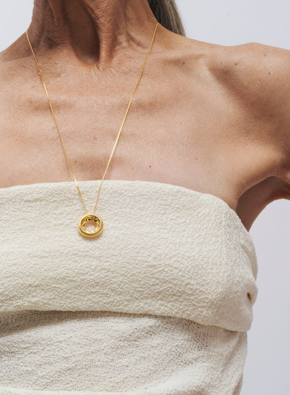 Sculptural Broken Donut pendant by YAN JIANG STUDIO, with organic circular form. handcrafted