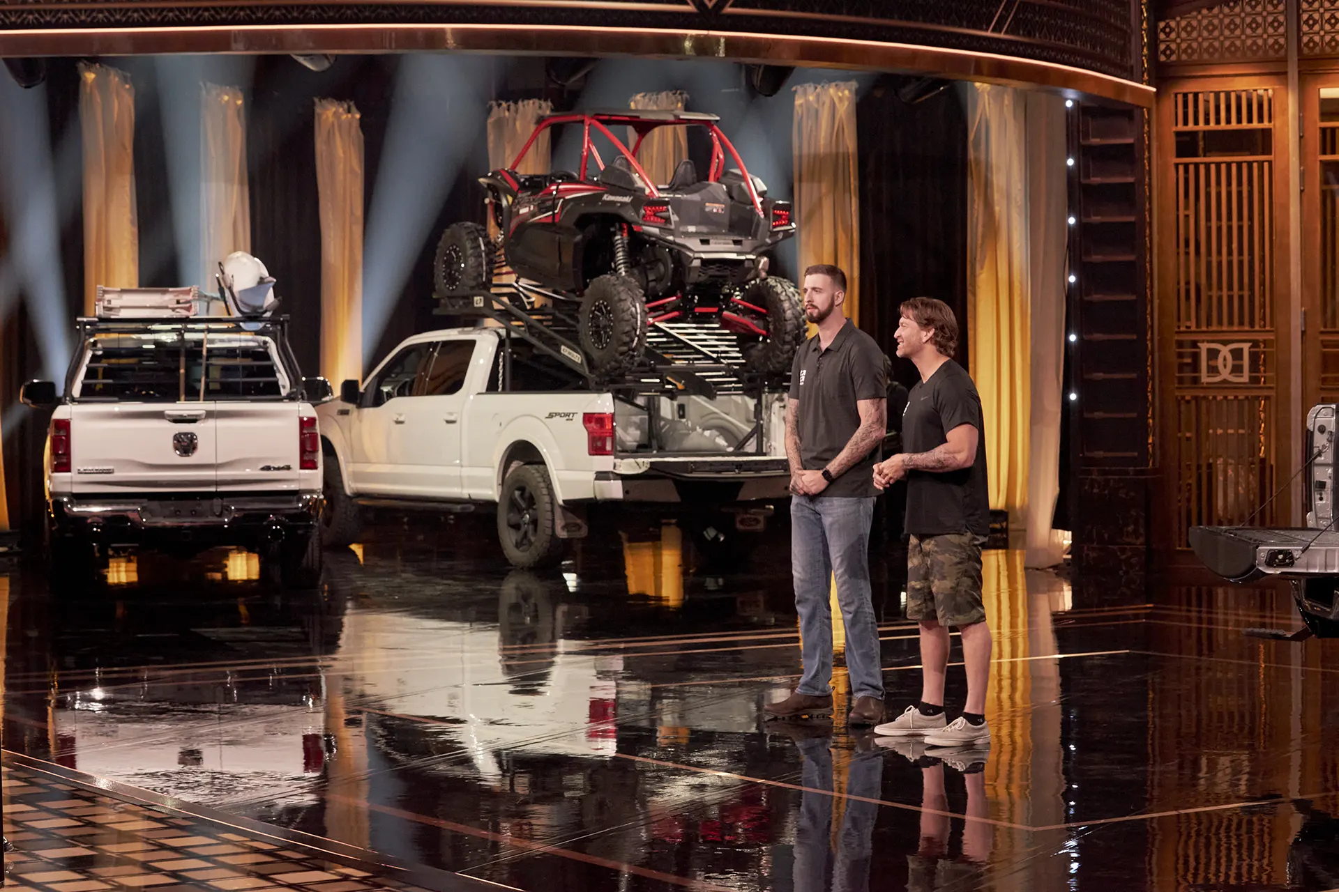 Cody New and Rick Sauder standing in front of the Dragon's on CBC Dragon's Den