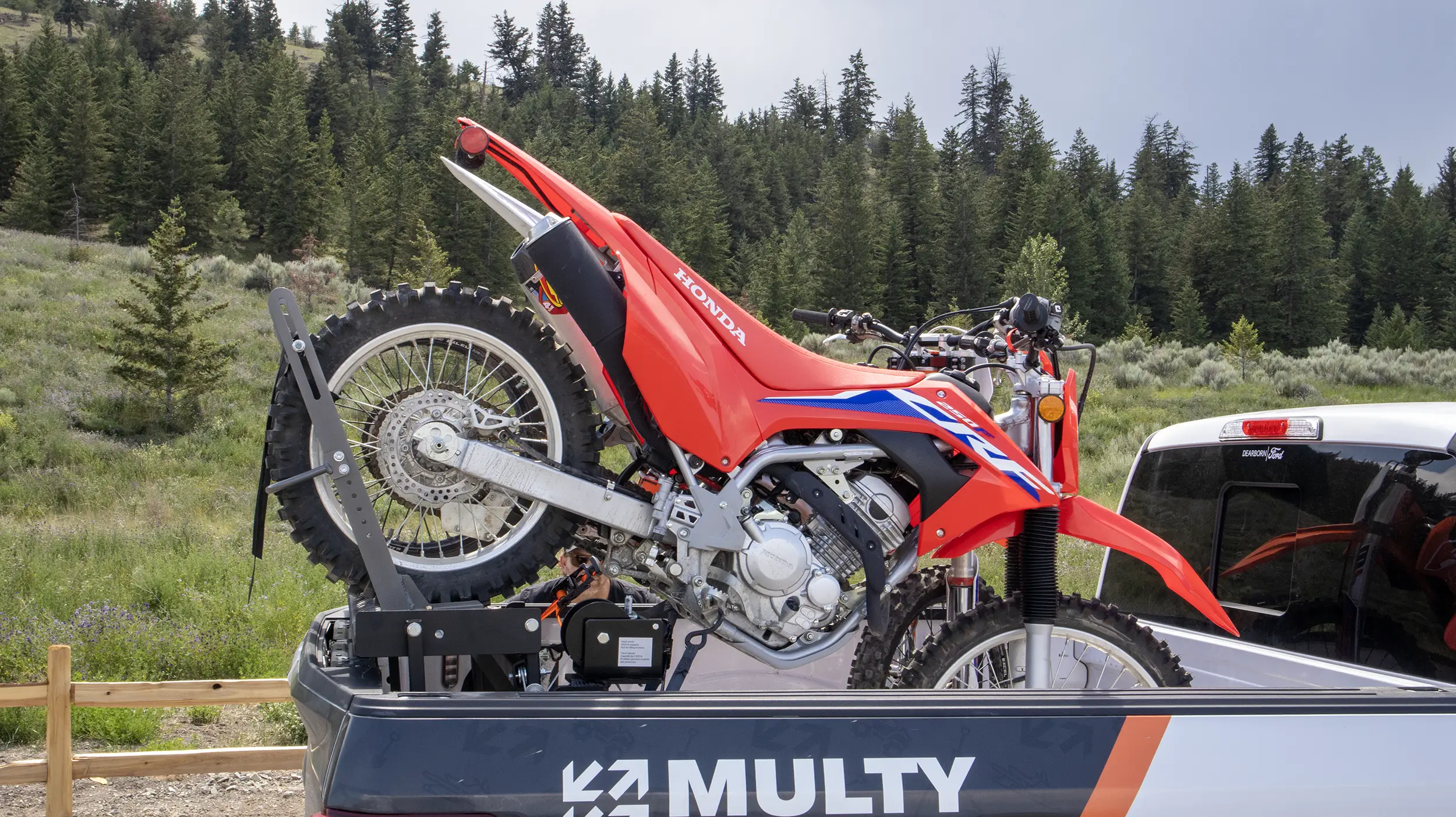 Upgrade your truck with the MULTY® Load Lifter, a powerful and versatile solution. This load lifter boasts an impressive lifting capacity of up to 2000 lbs, making it perfect for securely lifting ATVs or dirt bikes above your truck's tailgate. With a user-friendly hand winch (or cordless drill/impact gun compatibility), loading and unloading are effortless. Plus, the MULTY® Load Lifter includes motorbike brackets for securing up to 2 motorbikes. What sets it apart is the ability to close your tailgate behind your bikes, ensuring you can still tow a trailer when needed. Built with robust materials and precision engineering, it offers reliability under heavy loads and is perfect for both professional contractors and outdoor enthusiasts.