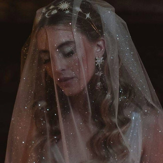 Iridescent wedding details with pearl accents and jewel tones for an Ethereal Shimmer wedding aesthetic