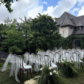 Chivari ceremony chairs with floating tulle for a french meadow style ceremony