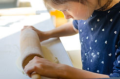 kid making pizza dough .jpeg
