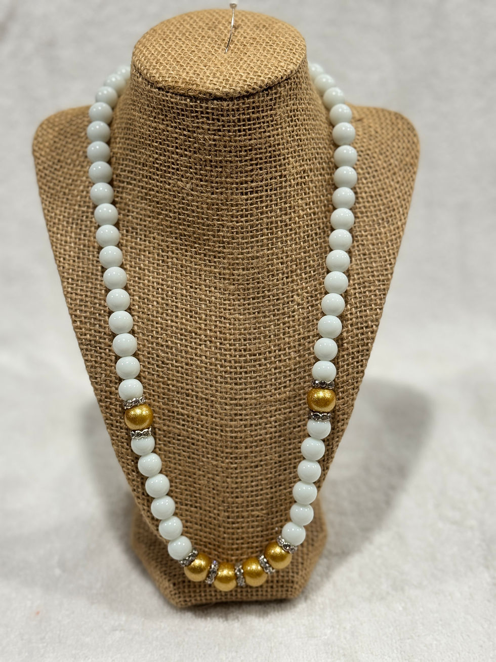 White necklace w/ golden beads