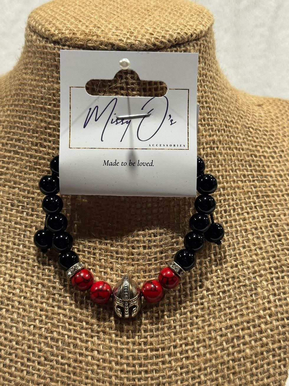 Black shiny bracelet w/ red & viking helmet