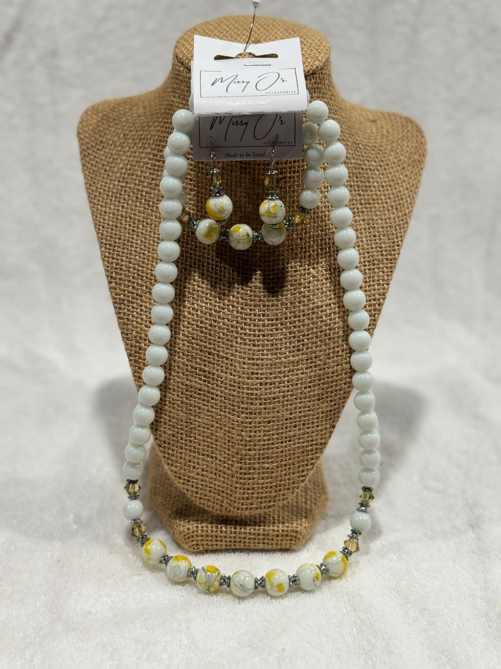 White yellow necklace, bracelet, and earring set