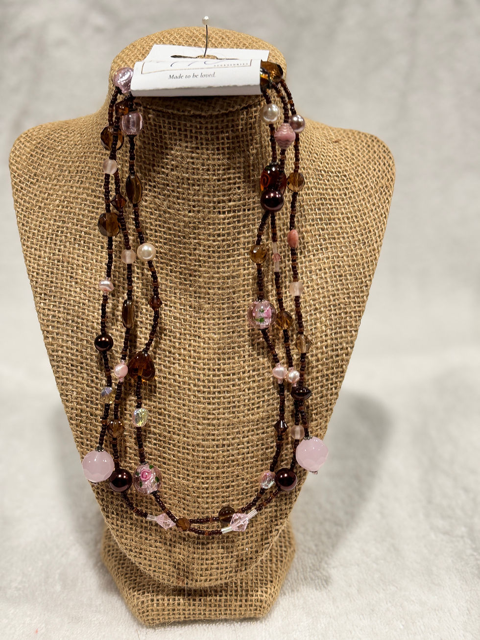 Long open brown necklace w/ pink