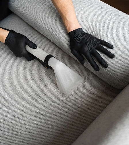 Extractor cleaning removes dust from the sofa at home. Dry-cleaning the upholstery furnitu