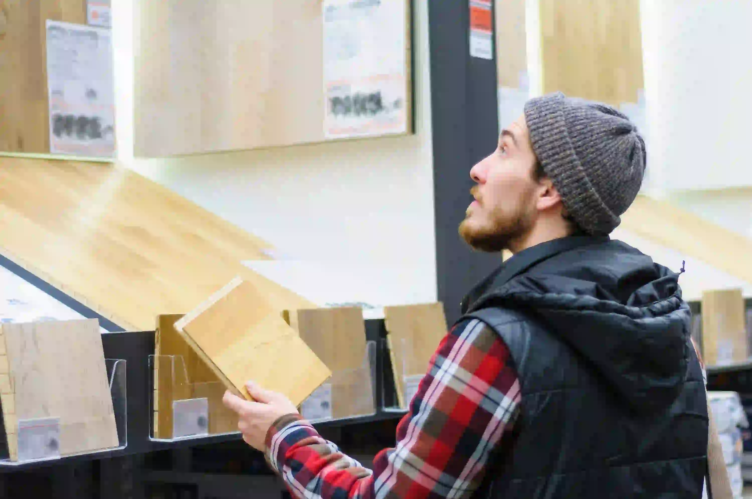 A Man is Shopping For Hardwood Flooring at Floors Depot Store
