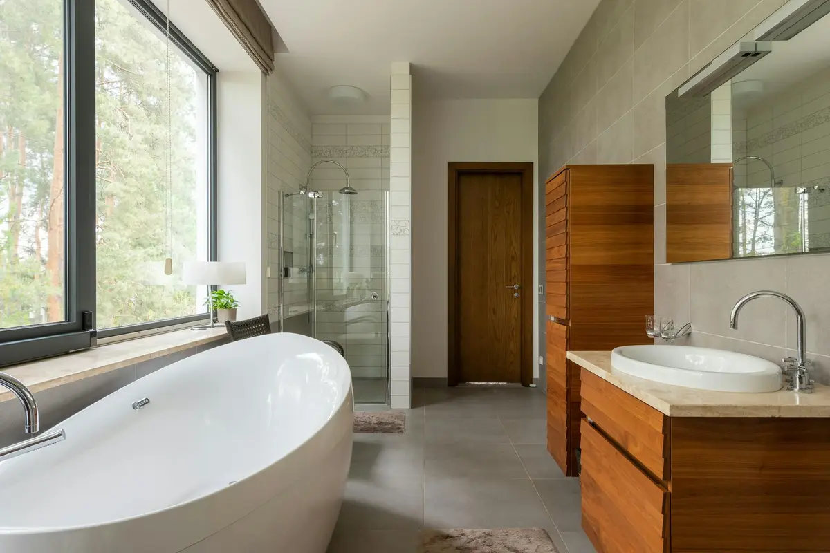 Modern condo bathroom renovation in Vancouver featuring sleek fixtures, glass shower, custom vanity, and contemporary tile design.