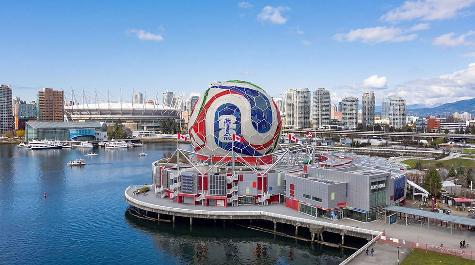 Science World waterfront in Vancouver with giant FIFA soccer ball dome, harbor boats, skyline, and blue sky.