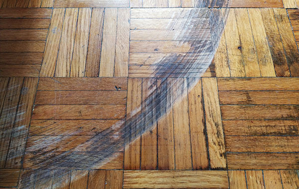 Scratched hardwood floor showing deep floor scratches that may need hardwood floor repair or refinishing