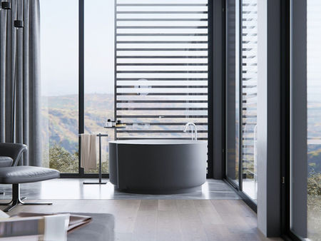 Modern bathroom interior in a North Vancouver home featuring sleek fixtures, glass shower enclosure, and contemporary tile design.