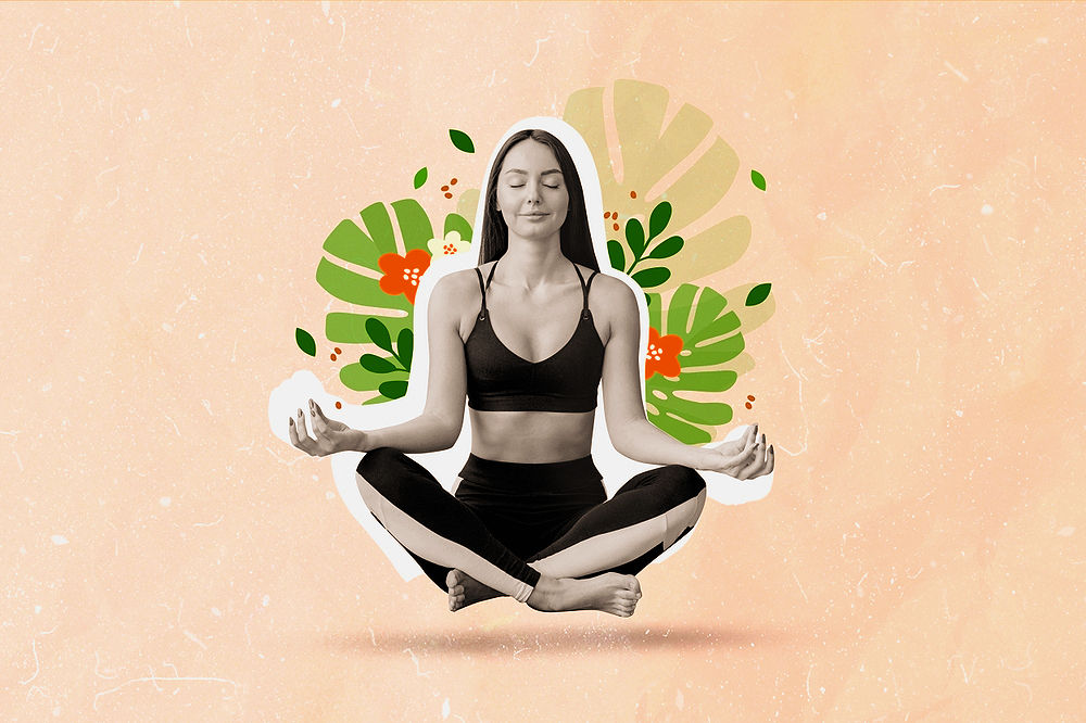 Woman in black sportswear meditating, sits cross-legged on beige background with green leaves and red flowers. Relaxed and serene mood.