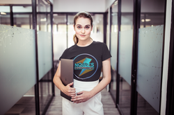 woman-wearing-a-tshirt-mockup-holding-a-laptop-in-a-corridor-at-the-office-a20516
