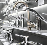 Water taps of different types and shapes on the counter in the store. Retail trade in sani