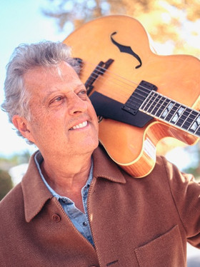 Grammy award winning guitarist & producer, Paul Brown, in the coat he got at Armani Wells, 2020