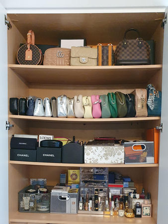 Designer bags and accessories on a shelf, Essex, London