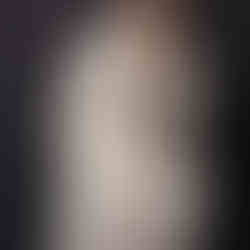 woman wearing a cream suit